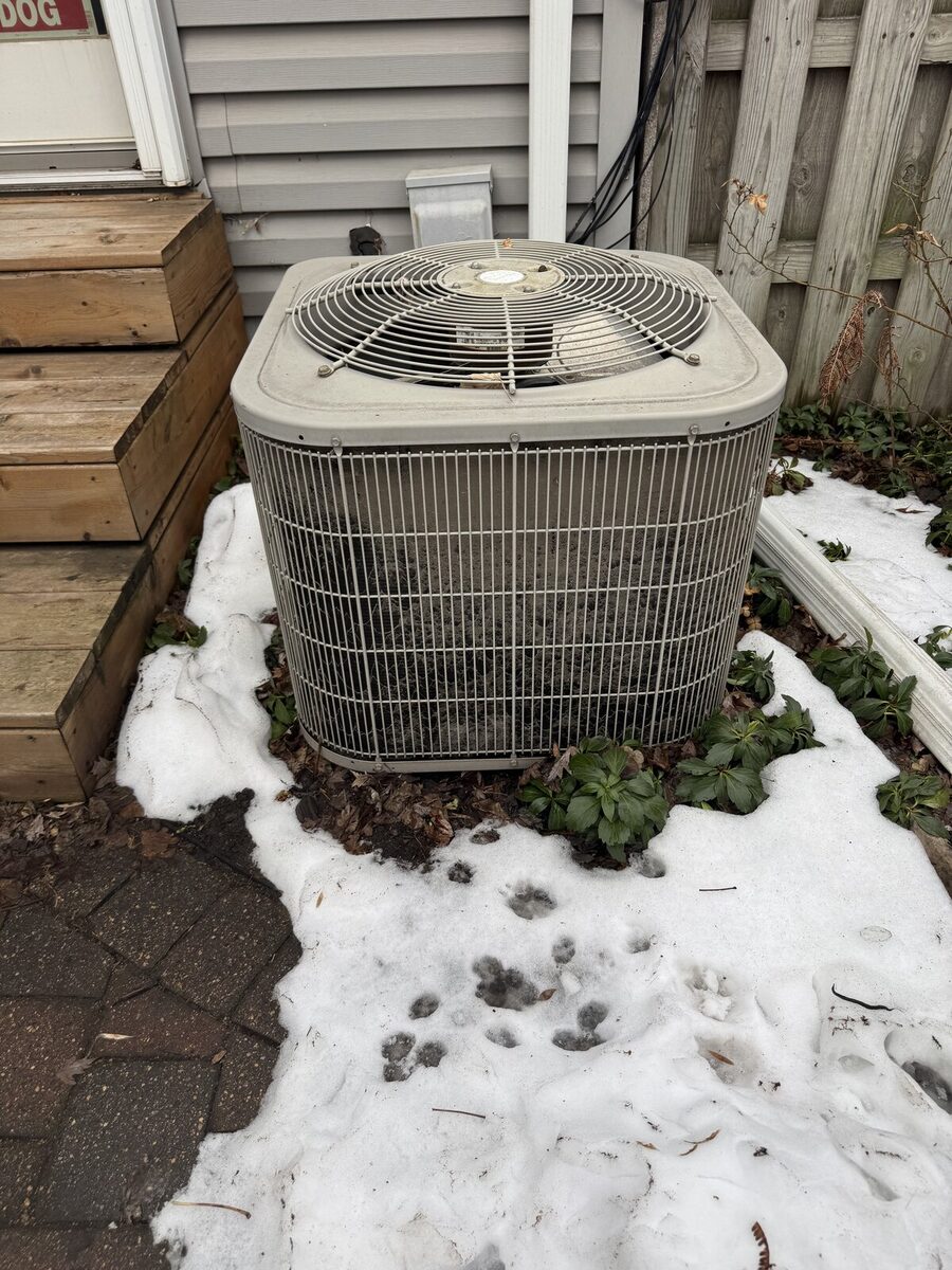 Worn, deteriorated AC unit before replacement