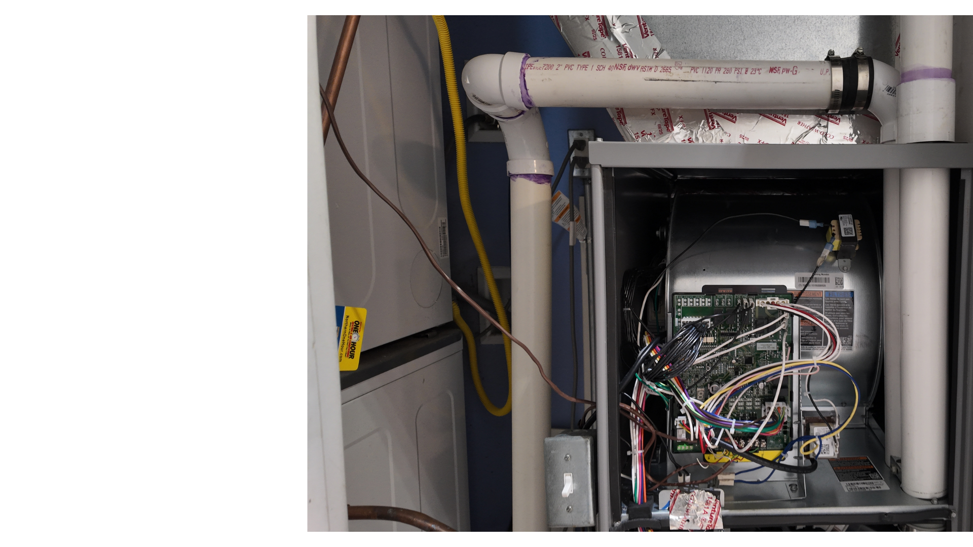 Justin Fodor diagnosing a furnace control board on a service call